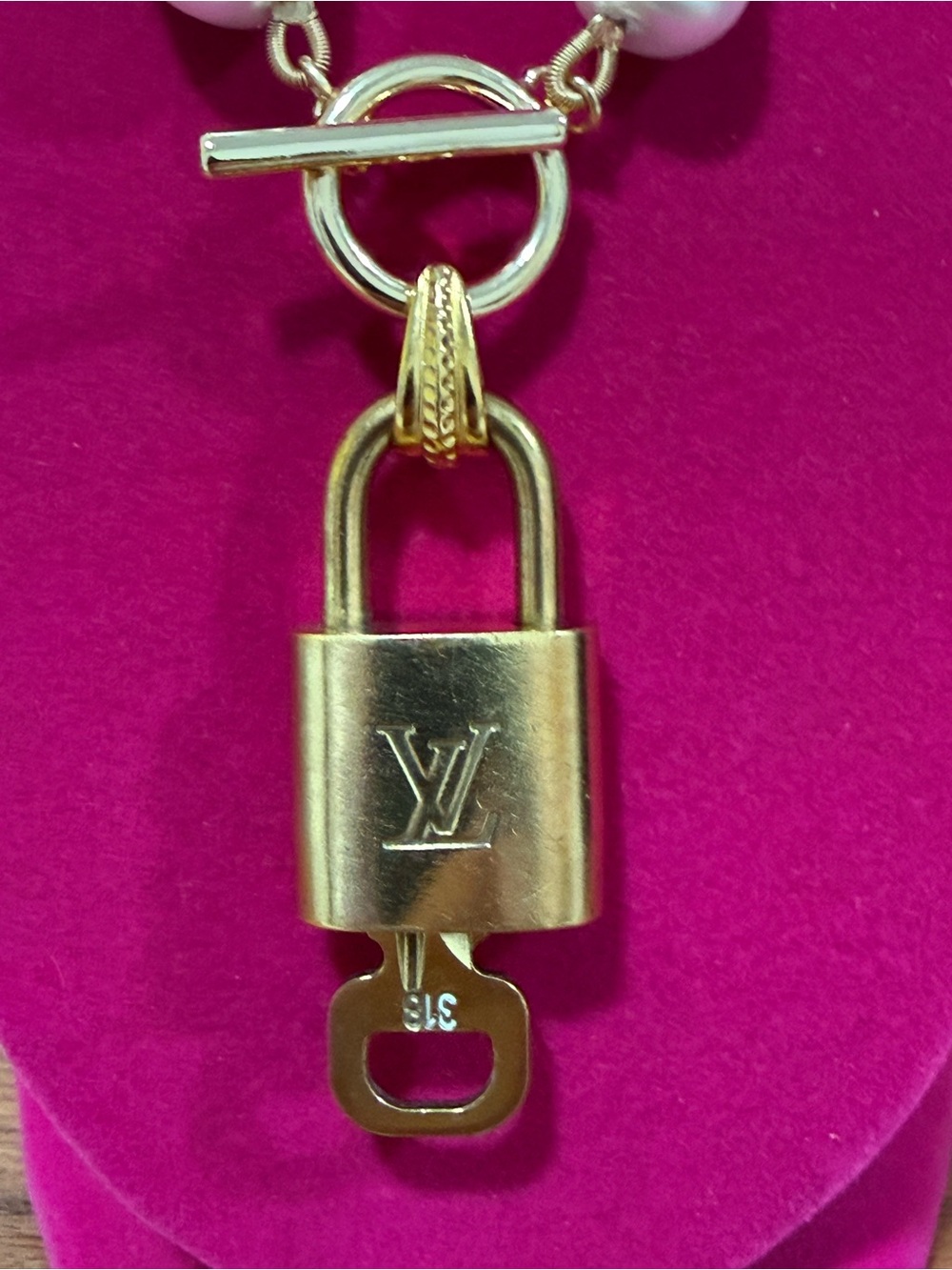 Authentic Louis Vuitton lock-n-key set with unbranded 18" gold plated chain. - Picture 3 of 6
